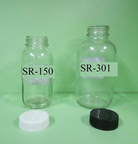 Round glass bottle with plastic cap